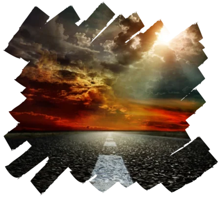 Eine leere Straße führt in einen dramatisch beleuchteten Horizont – Symbol für Veränderung und Neuanfang.